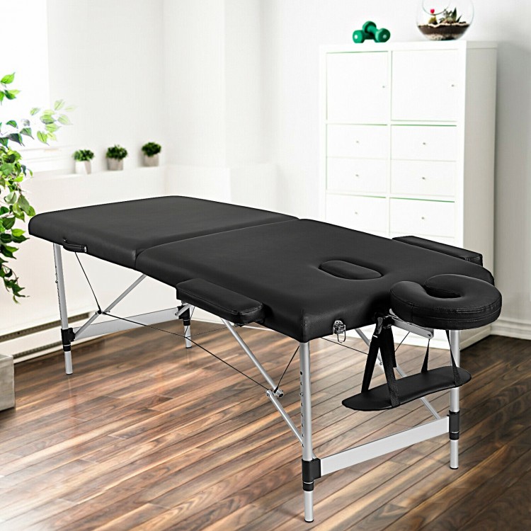 Close-up view of the black portable massage bed's high-density sponge and PVC leather, offering exceptional comfort for.