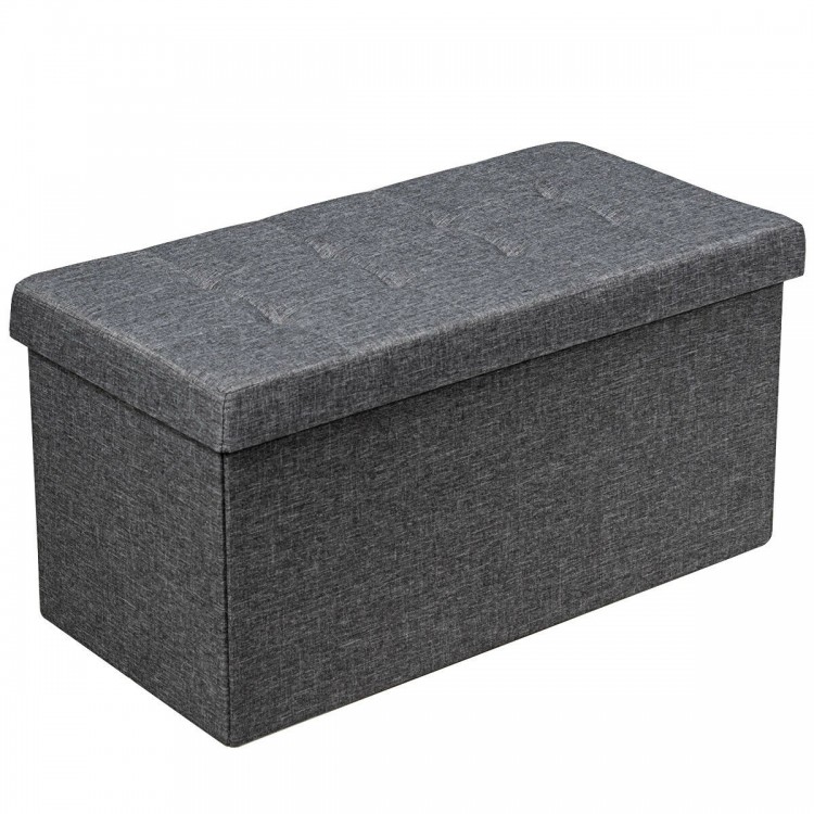 Dark gray foldable storage ottoman with padded seat and roomy interior for blankets, clothes, and toys, ideal for any.