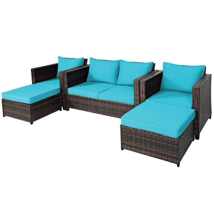 Turquoise cushioned ottoman from the 5-piece patio rattan furniture set, versatile for use as a coffee table outdoors.
