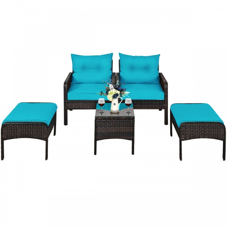 Turquoise cushioned ottoman from a 5 pcs patio rattan furniture set, ideal for outdoor lounging and relaxation.