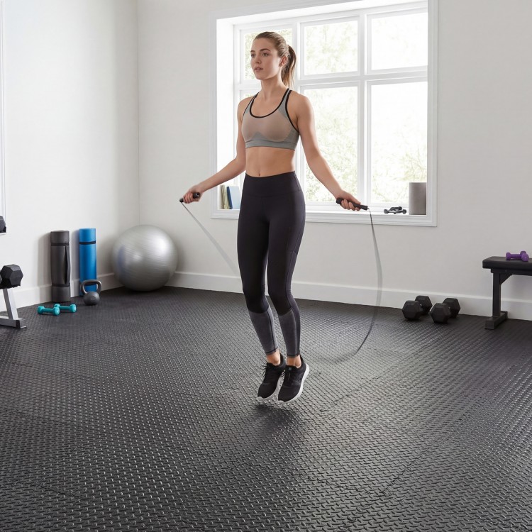 Black EVA foam puzzle exercise floor mats, ideal for home workouts, yoga, and protecting floors from damage.