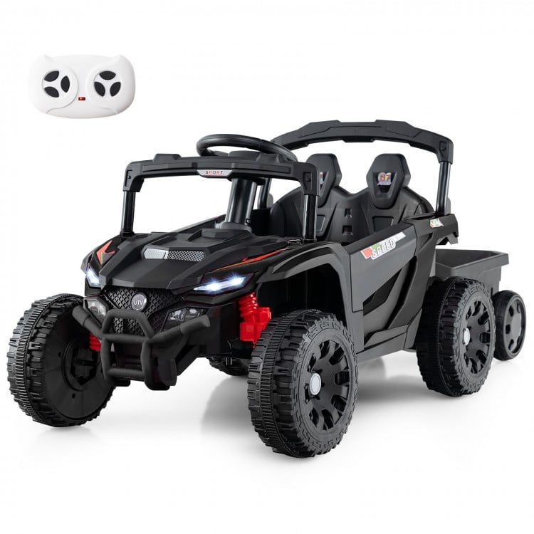 Battery-powered ride-on tractor in dark gray with remote control, detachable trailer, and LED headlights for kids'.