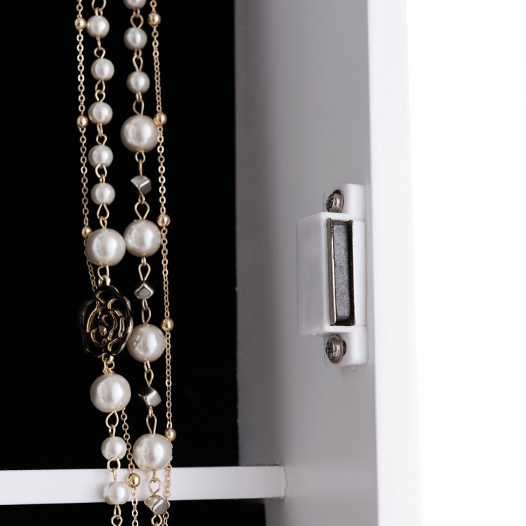 Close-up of the wall-mounted jewelry armoire with pearl necklaces, featuring a sleek design and organized storage.