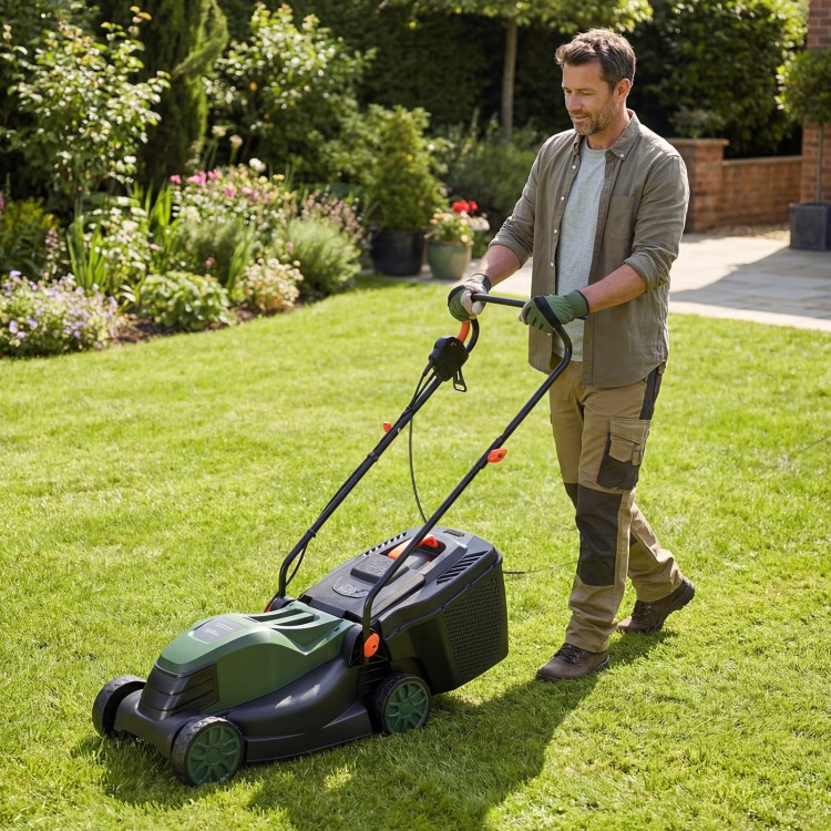 Electric corded lawn mower with a 13.5-inch cutting width and 35L collection box, shown in use on a lawn.