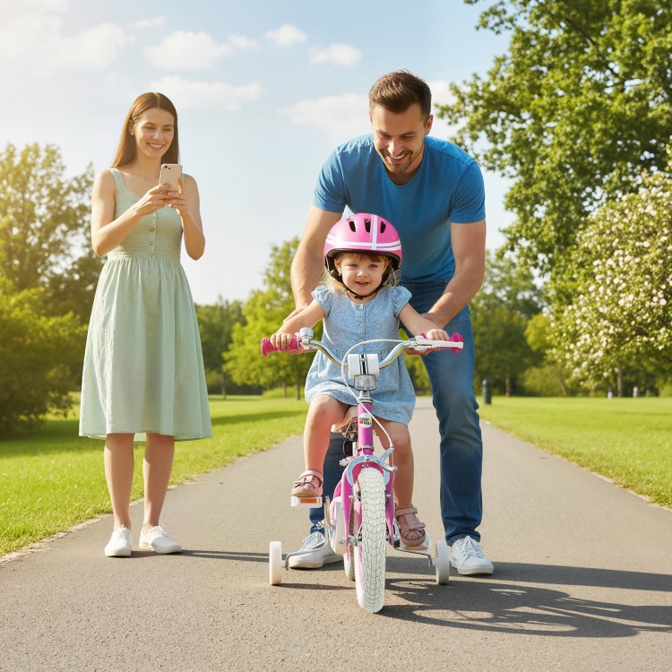 Child riding a pink 12-inch bike with training wheels, featuring adjustable handlebars and a hand brake for safety.