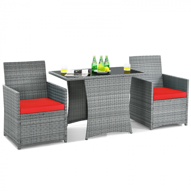 3-piece patio rattan furniture set with cushioned armrests and red cushions, ideal for outdoor dining and relaxation.