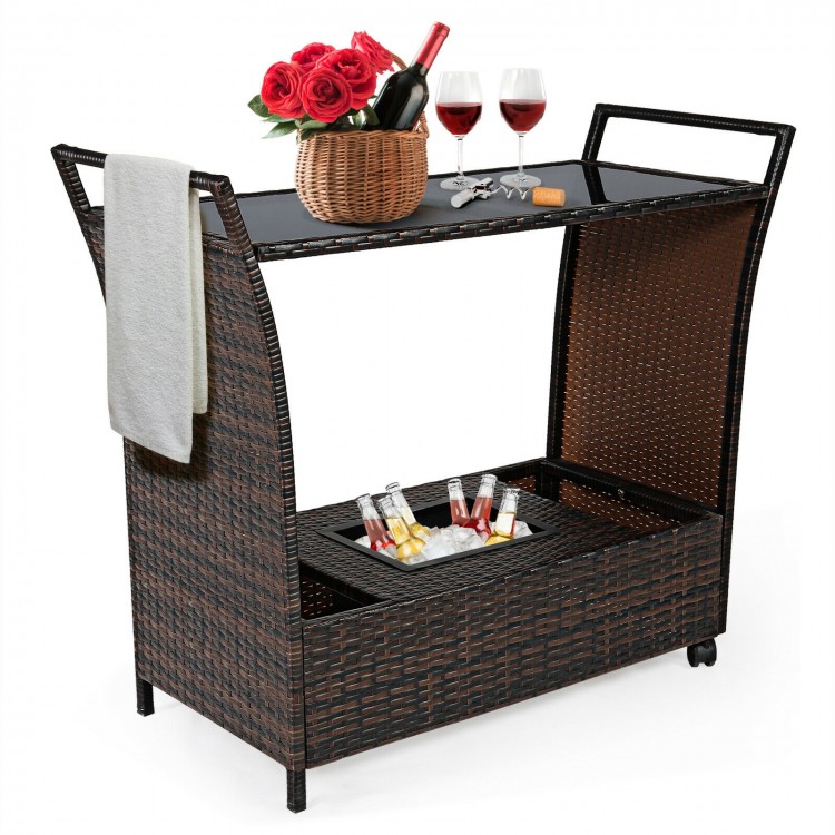 Patio rattan bar serving cart with glass top, removable ice bucket, and wheels for easy outdoor entertaining.