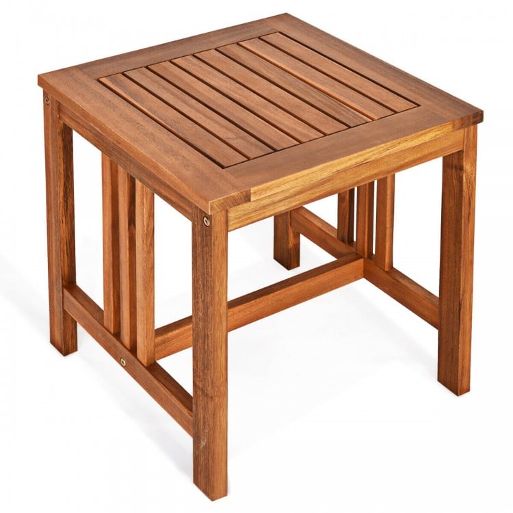 Square coffee table made of acacia wood, featuring a slatted top design, perfect for outdoor patio use.