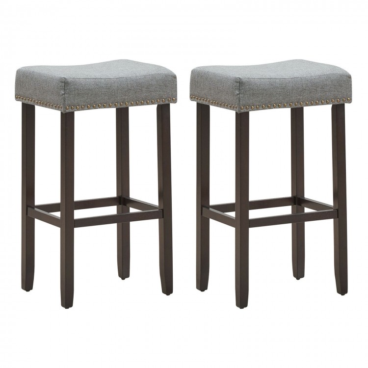 Set of 2 gray nailhead saddle bar stools with solid rubberwood legs, 29-inch height for versatile seating.