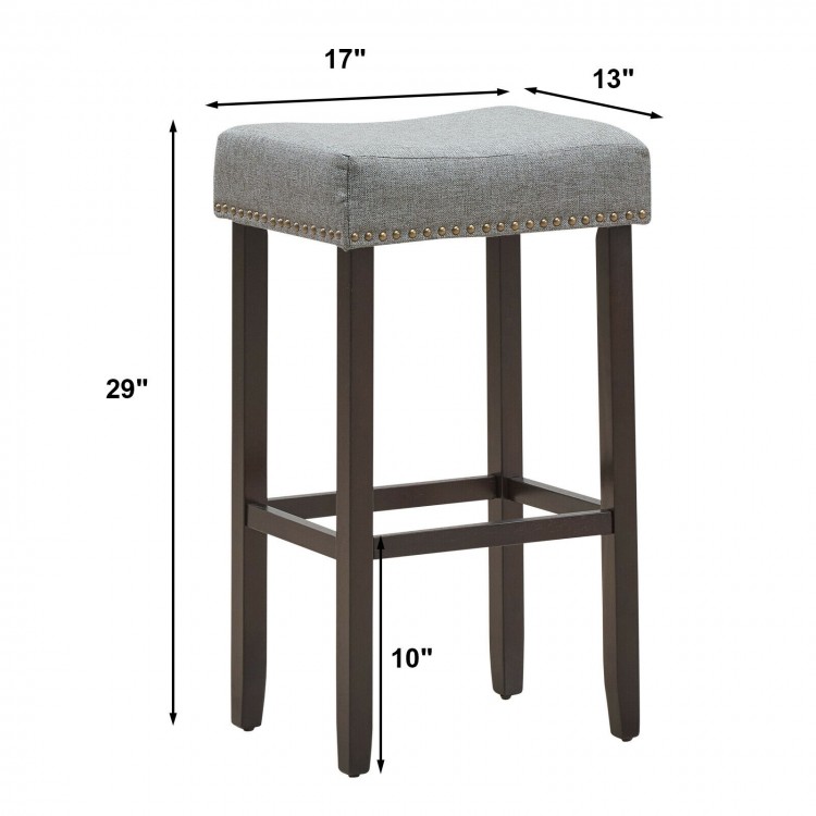 Gray nailhead saddle bar stool with solid rubberwood legs, 29-inch height, ideal for bars and kitchens.