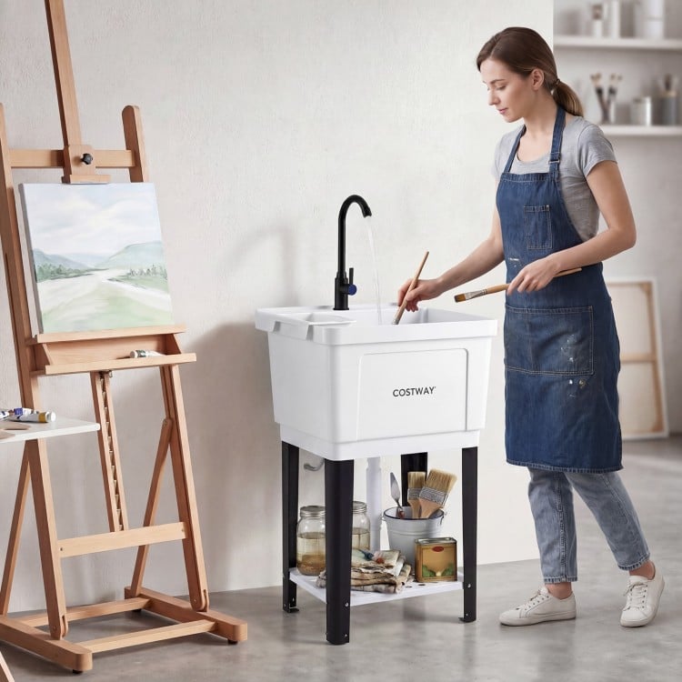 Utility sink with rotating faucet and adjustable legs, ideal for laundry and gardening, featuring a large 14.5 Gal.