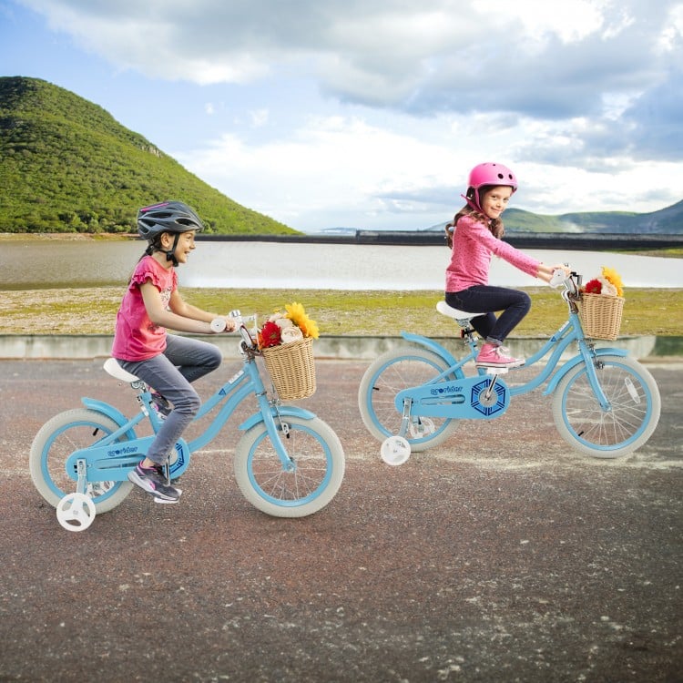 Two kids riding the 14-inch blue bike with training wheels, featuring a front basket for toys and adjustable seat.