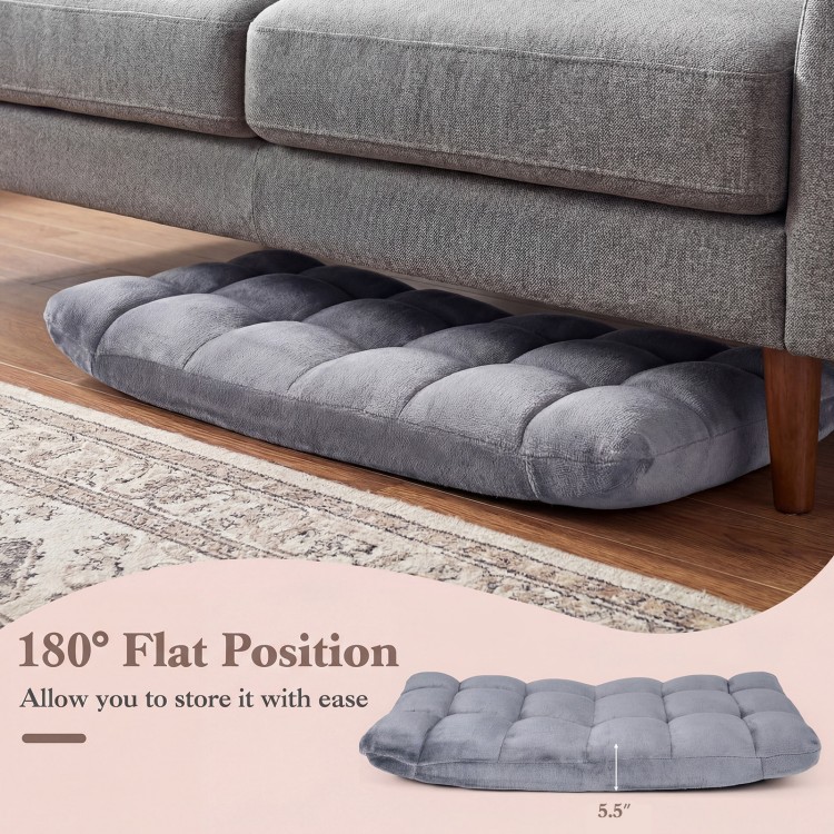 Light gray cushioned floor chair in flat position, featuring thick padding and adjustable design for easy storage.