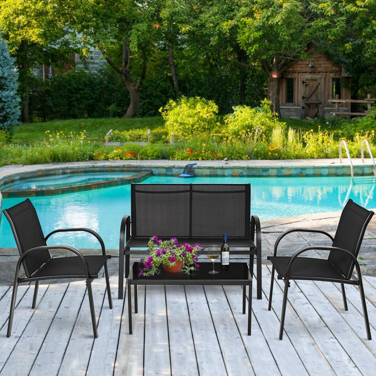 Black glass top coffee table from the 4-piece patio furniture set, ideal for outdoor relaxation and entertaining.