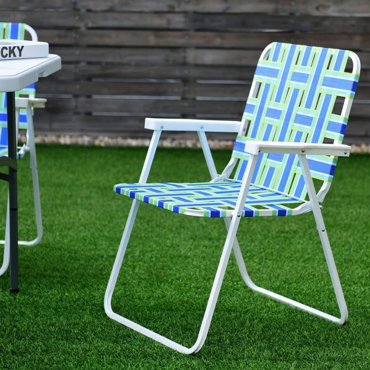 Folding beach chair with blue webbing and white steel frame, ideal for camping and outdoor activities.