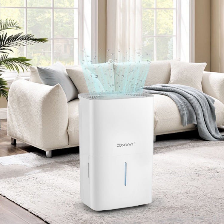 150 pints dehumidifier in white with LED display, placed in a cozy living room for effective humidity control.