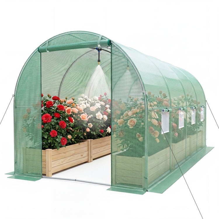 Walk-in tunnel greenhouse features a spacious interior, reinforced waterproof cover, and built-in watering system for easy gardening.