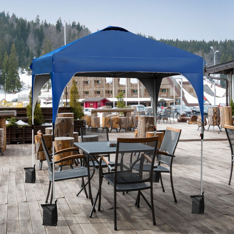 Blue 6.6 x 6.6 FT pop-up canopy tent with adjustable height, ideal for outdoor shade and activities, shown in a patio.