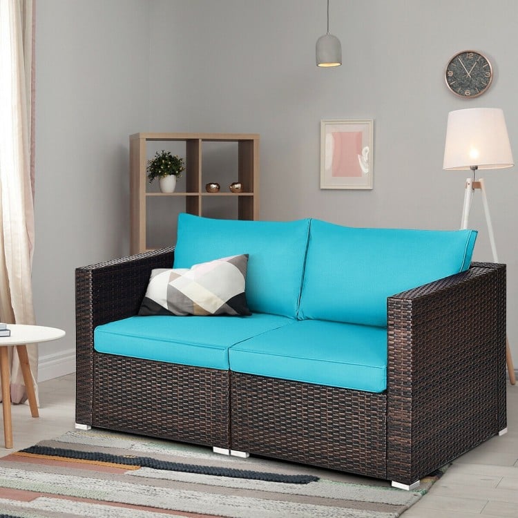 Two-piece patio rattan sectional sofa set in blue with thick cushions, perfect for indoor or outdoor relaxation.