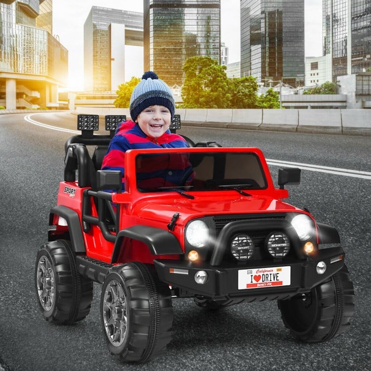 Red 12V 2-seater ride-on car with remote control, featuring storage, LED lights, and spring suspension for smooth.