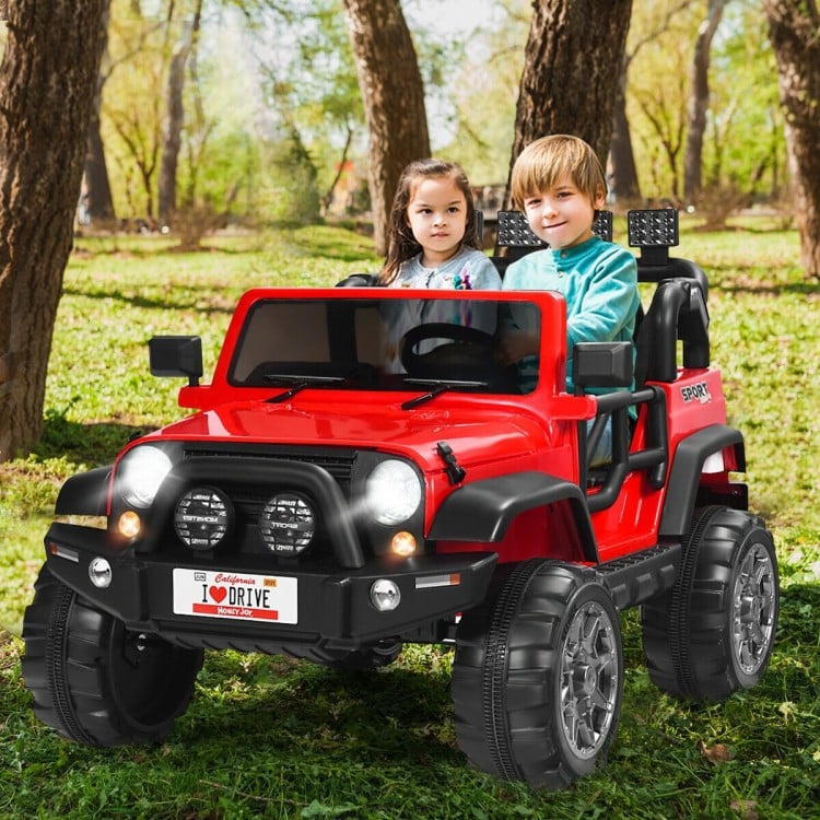 Red 12V 2-seater ride-on car with remote control, storage space, and LED lights, perfect for outdoor fun.