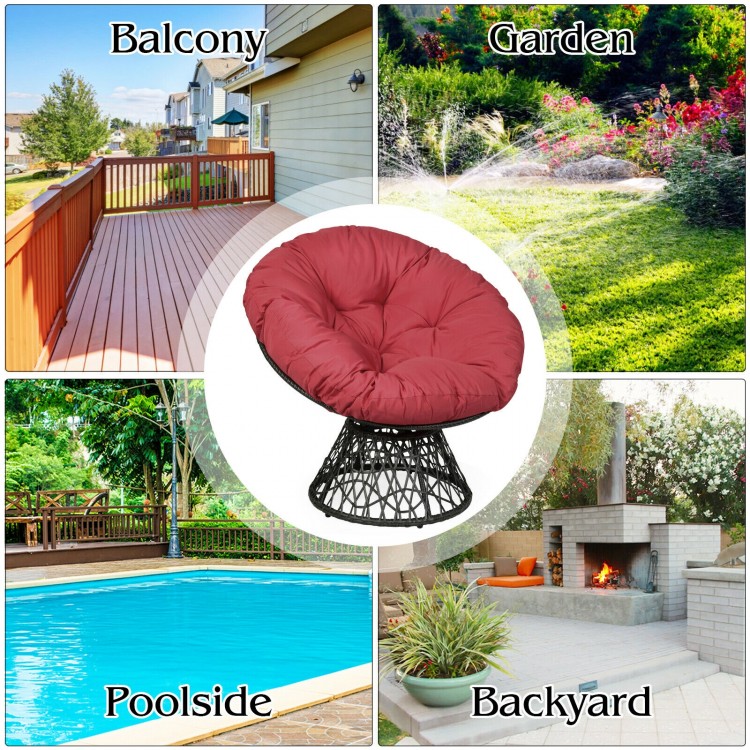 Dark red rattan Papasan chair with soft cushion, 360-degree swivel, perfect for balcony, garden, or poolside relaxation.