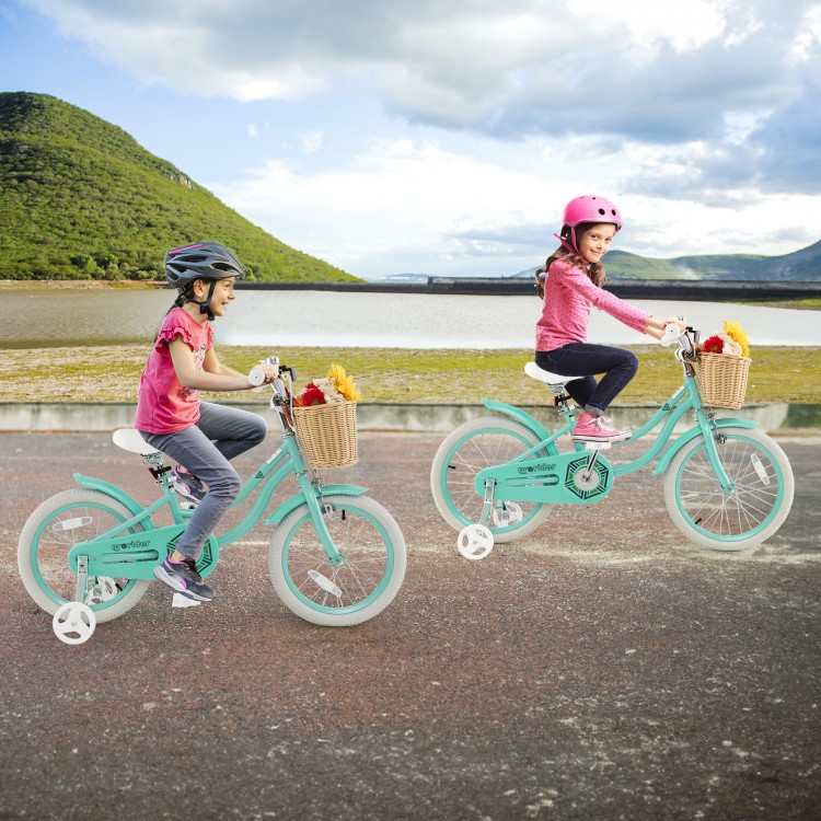 Two kids riding the 18-inch green bike with training wheels, featuring a front basket for toys and adjustable seat.