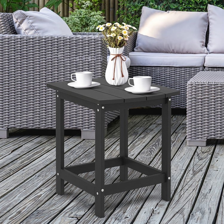 Black 18-inch weather-resistant side table made of HDPE, perfect for outdoor use by the poolside or patio.