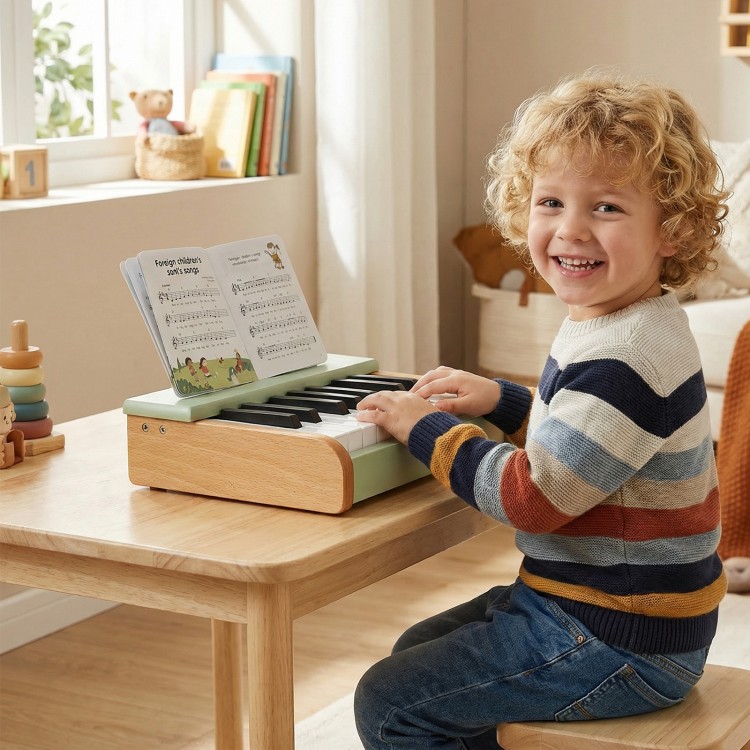 Child playing the 18 keys wooden piano for kids, featuring a removable music stand, perfect for educational fun.