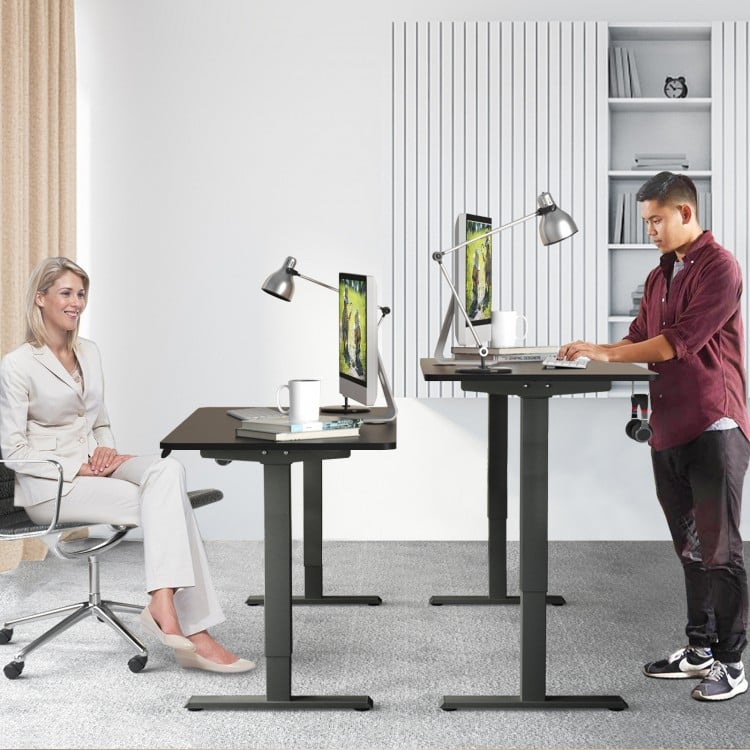 Electric height adjustable standing desk in black with memory controller, ideal for ergonomic home or office use.