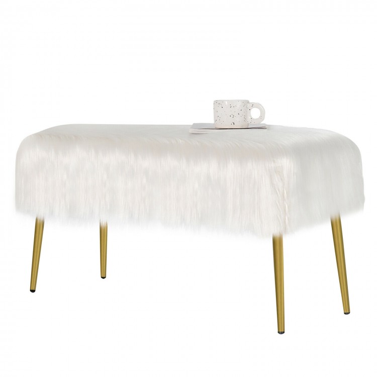 Upholstered faux fur vanity stool with golden legs, ideal for makeup rooms, offering comfort and modern style.
