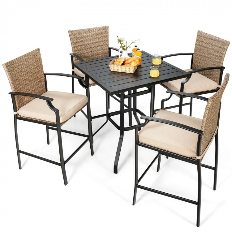 5-piece outdoor rattan bistro set featuring 4 bar stools with cushions and a sturdy table, ideal for backyard.