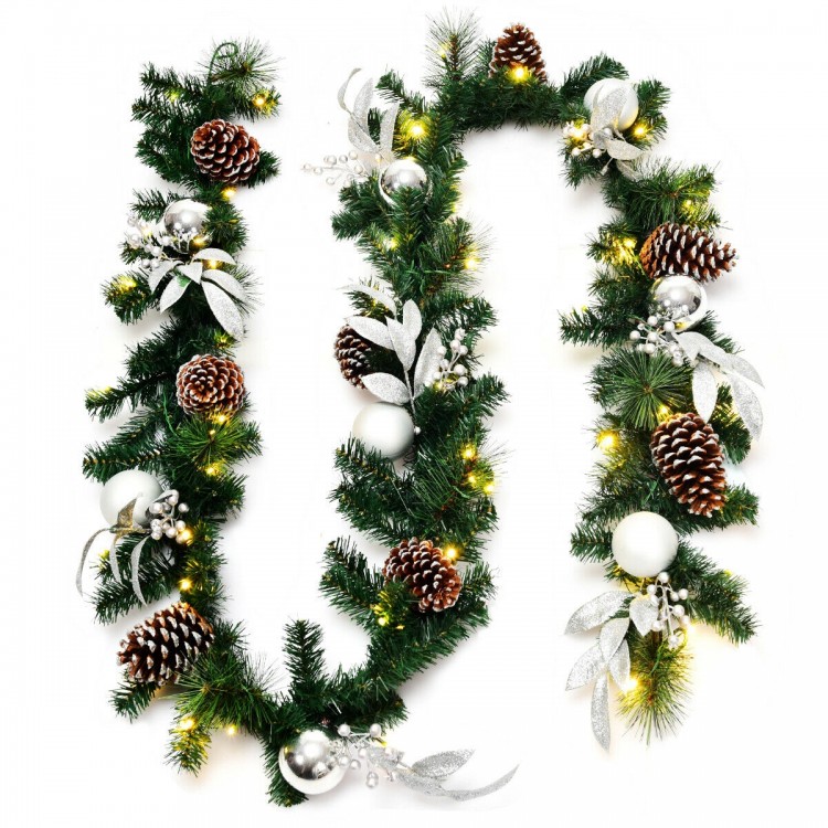 9-foot pre-lit artificial Christmas garland with 50 warm white LED lights, pinecones, and silver ornaments for festive.