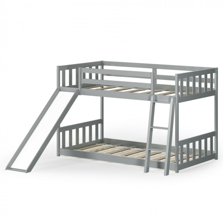 Twin over twin gray wooden bunk bed with slide and ladder, designed for kids' safety and fun in a compact space.