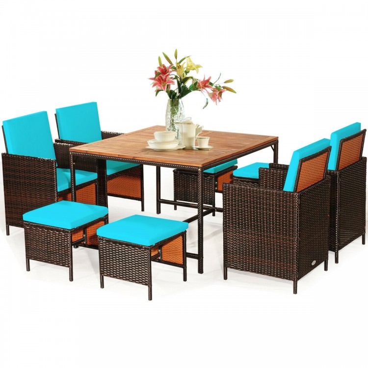9-piece patio dining set featuring cushioned turquoise chairs and acacia wood tabletop, perfect for outdoor gatherings.