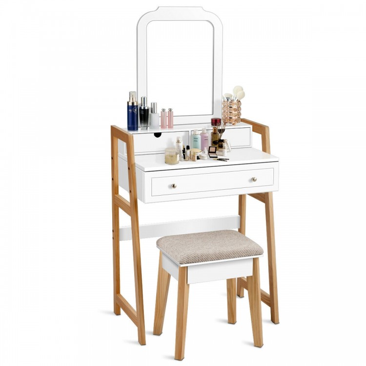 Vanity table set with cushioned stool, large mirror, and three drawers for organized cosmetic storage.