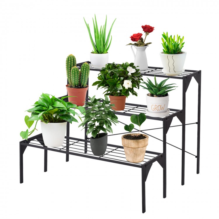 Three-tier metal plant stand showcasing various potted plants, ideal for outdoor patio or interior decor organization.