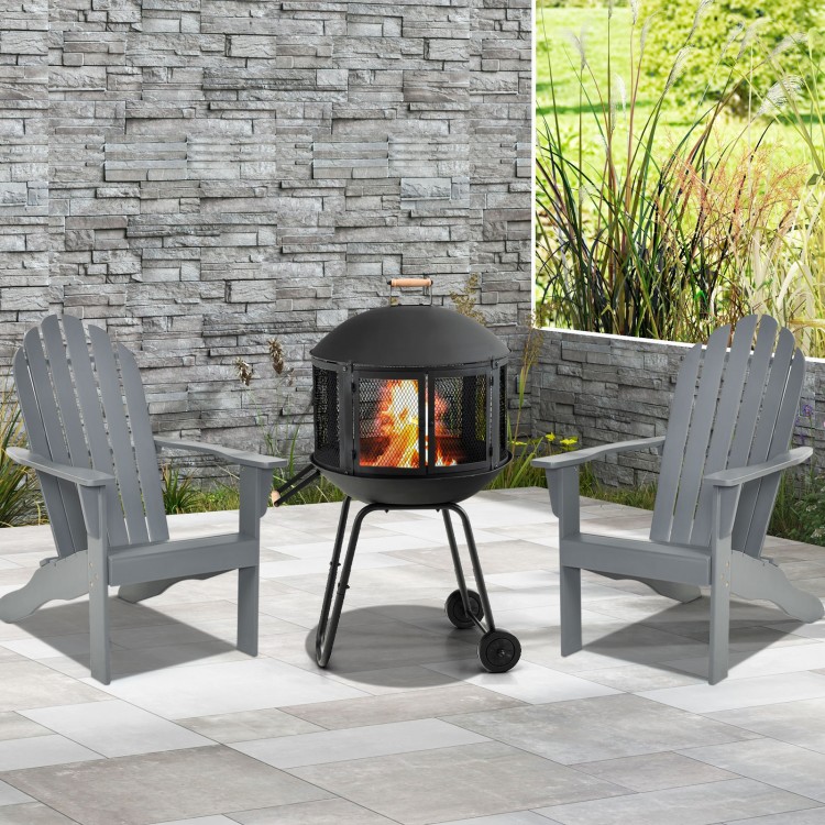 28-inch portable black fire pit on wheels with log grate, ideal for heating or barbecue, set in a stylish outdoor space.