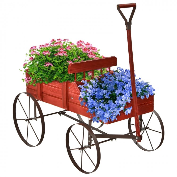 Wooden wagon plant bed in red with flowers, featuring two planting sections and four metal wheels for easy movement.