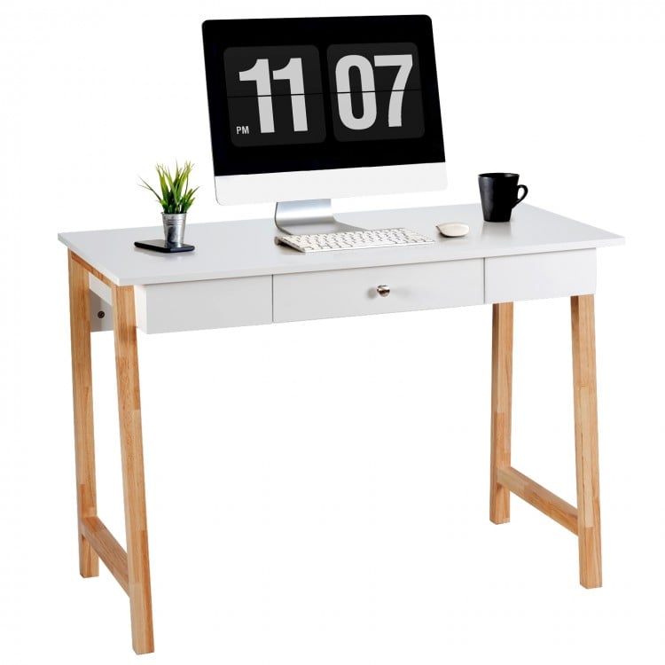 Modern computer desk with rubberwood legs, spacious white surface, and a large drawer for versatile home office use.