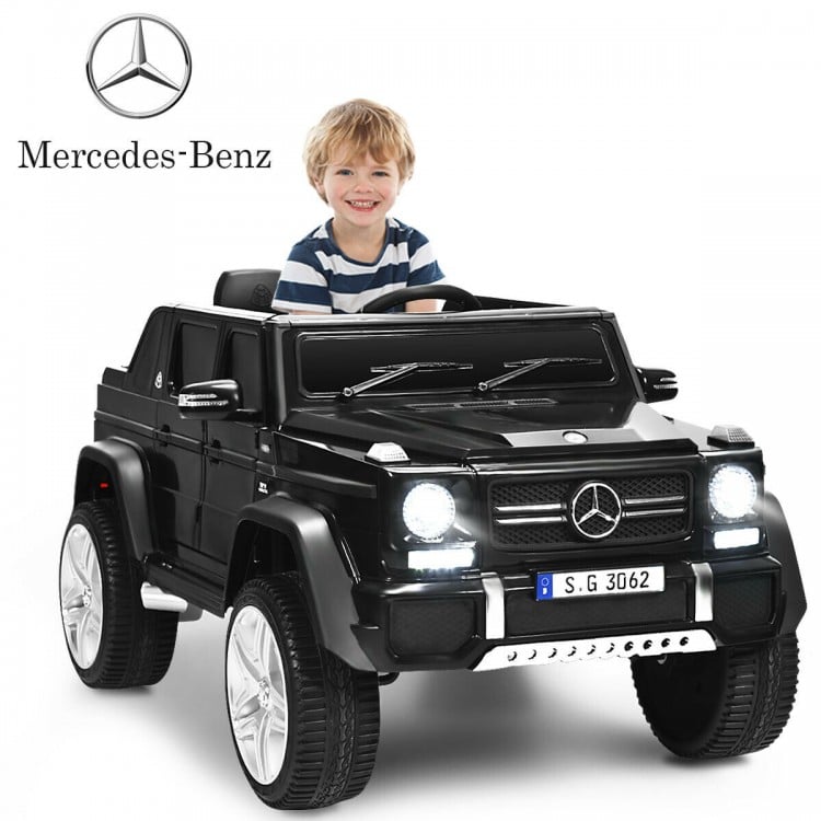 Close-up of the black 12V licensed Mercedes-Benz kids ride-on car's stylish exterior and bright LED headlights for.