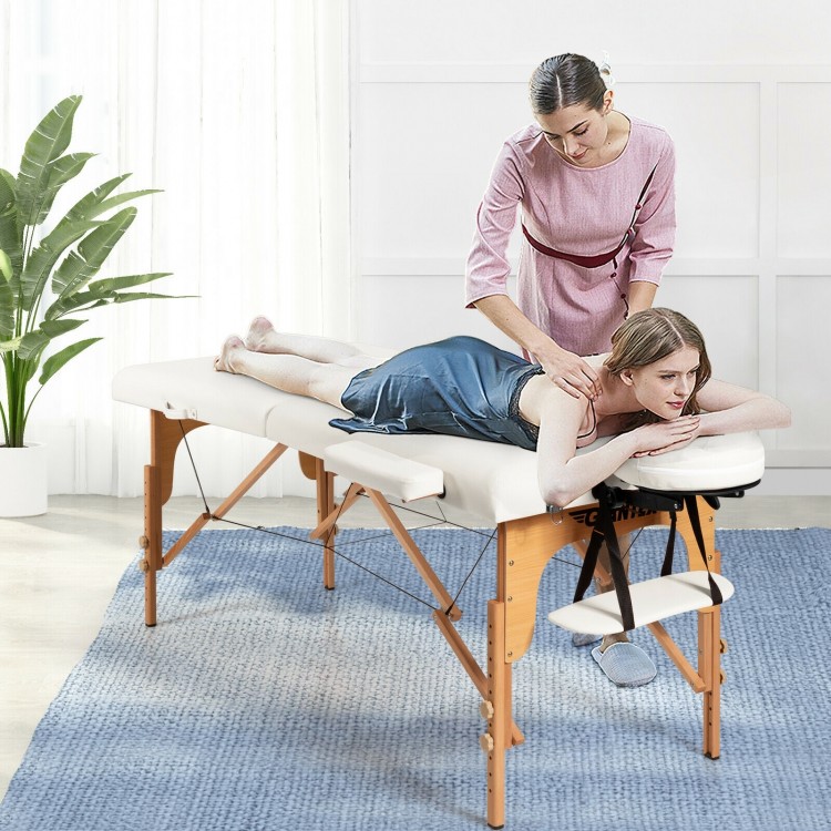 Portable adjustable facial spa bed in white with a therapist and client, ideal for massage and spa treatments.