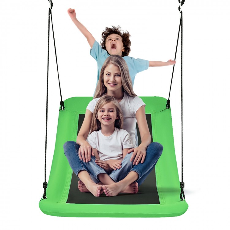 Family happily sitting on the giant 60-inch green platform tree swing, designed for kids and adults, suitable for.