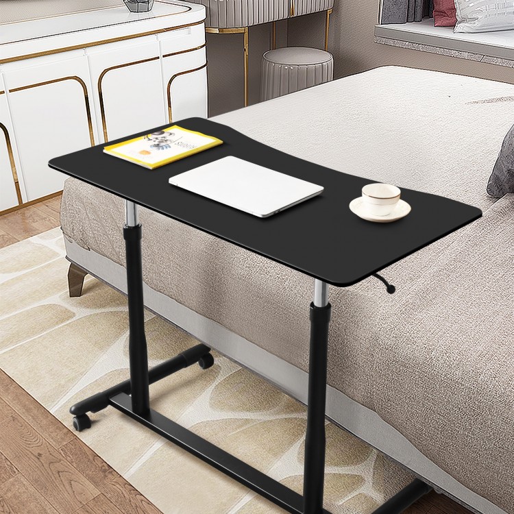 Height adjustable black computer desk with smooth tabletop, ergonomic edges, and wheels for easy mobility in home or.
