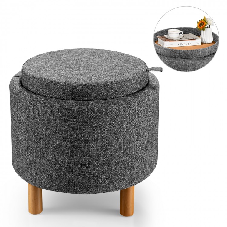 Round gray fabric storage ottoman with removable lid and wooden tray, perfect for extra seating and concealed storage.