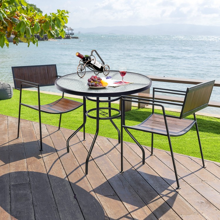 Round 32-inch patio table with tempered glass top and steel frame, featuring an umbrella hole, perfect for outdoor.