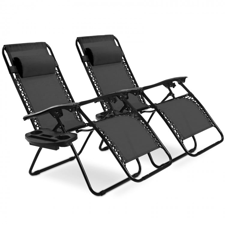 Two black folding lounge chairs with adjustable backs and removable headrests, perfect for outdoor relaxation.