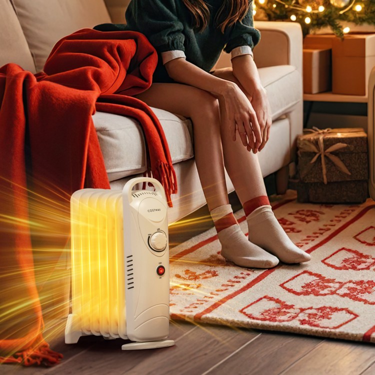 Electric oil-filled radiator heater in white, 700W, with adjustable thermostat, providing silent warmth for cozy spaces.