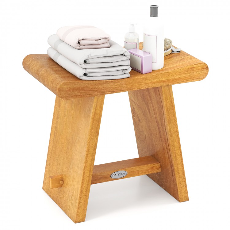 Teak shower bench with curved seat, solid construction, and water-resistant finish, ideal for shaving legs or as a side.