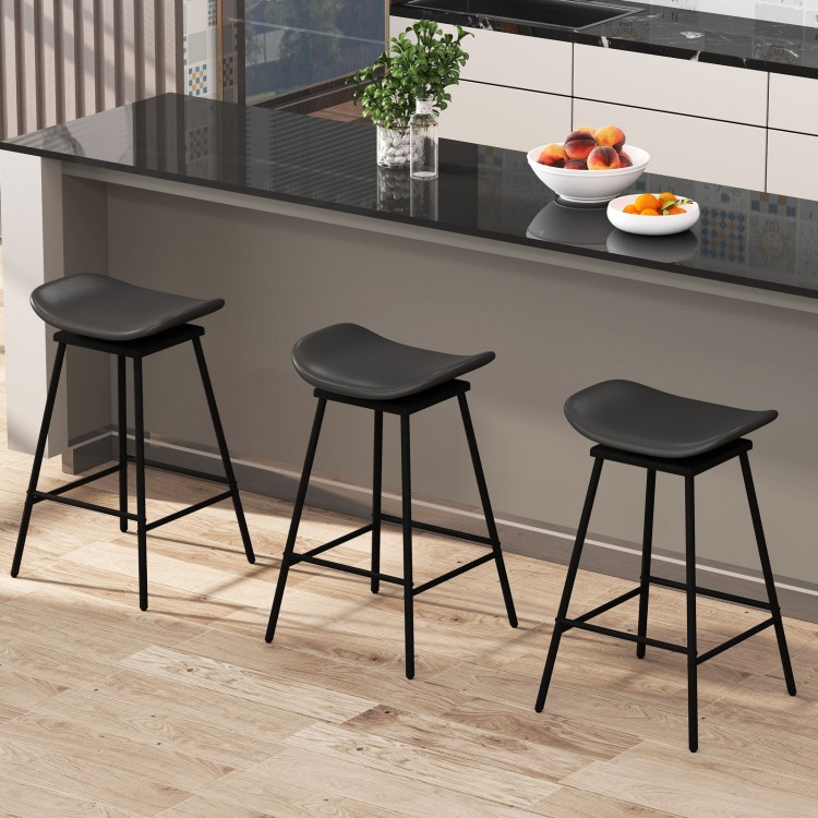Set of 2 black swivel barstools with faux leather seats and footrests, ideal for kitchen islands or home bars.